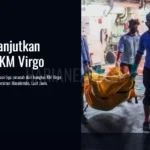 Keterangan gambar, Personel TNI AL menurunkan jenazah dari KRI I Gusti Ngurah Rai-332 menuju perahu karet Basarnas saat operasi SAR KM Virgo Transport 8 di perairan Masalembo, Laut Jawa, Jumat (18/09).